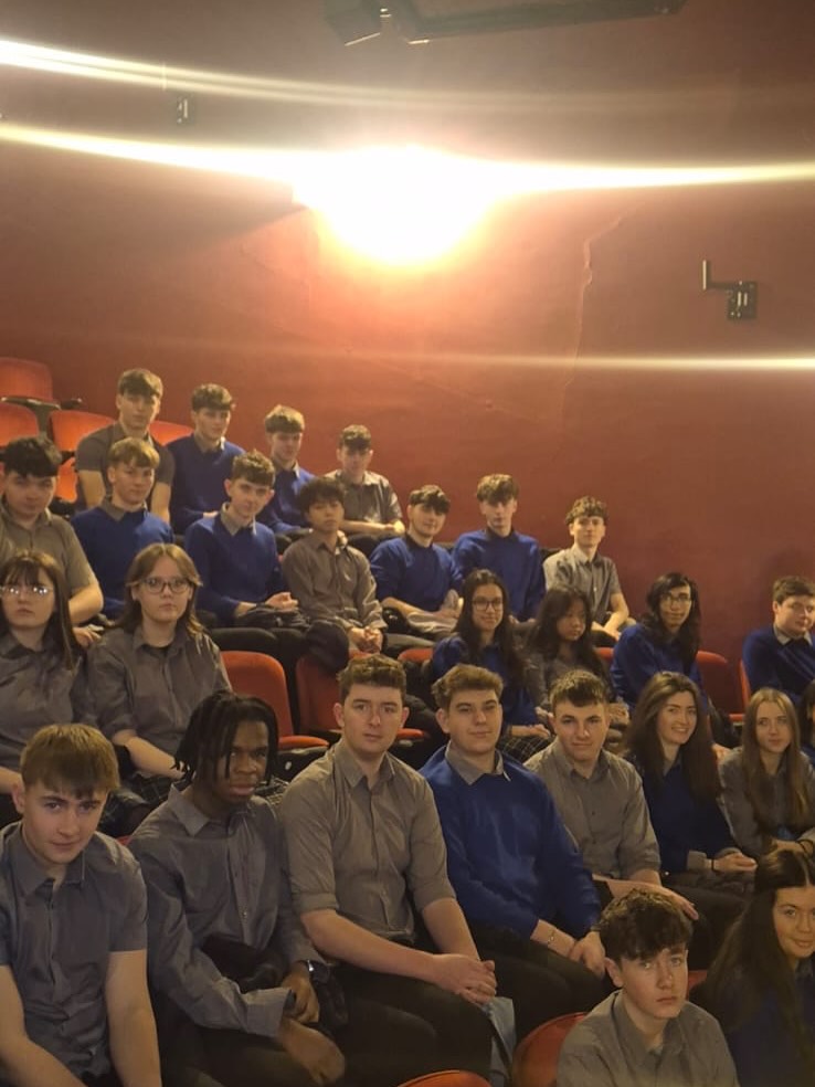 Students seated in the theatre